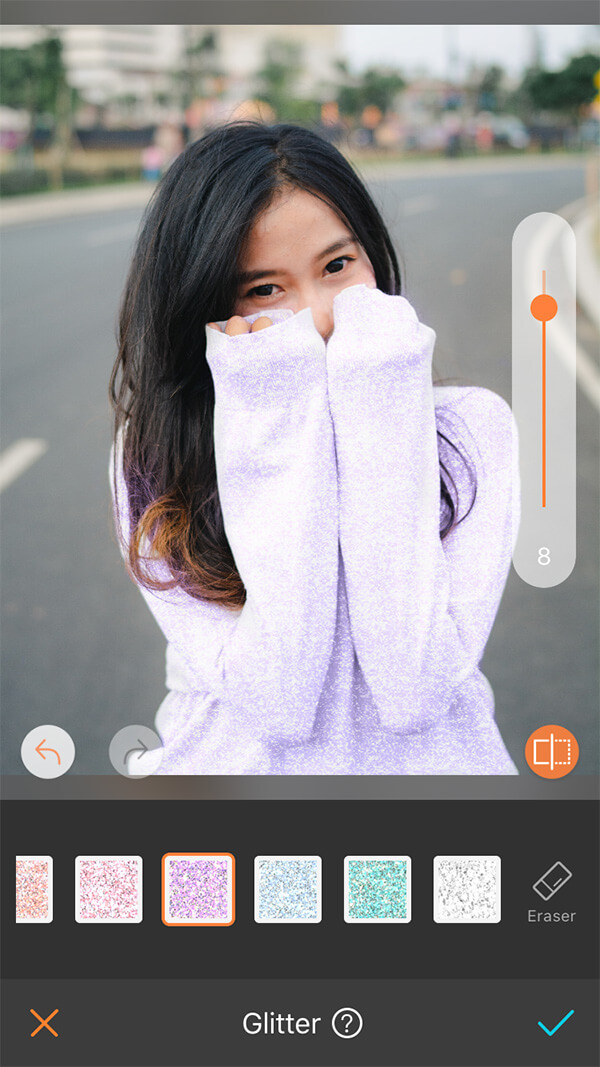 girl with black hair in purple sweater standing in the road