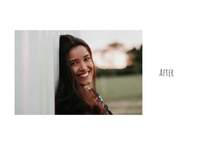 photo of a smiling woman leaning against a wall