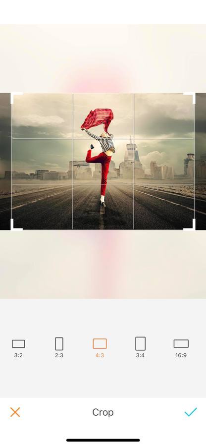 Cropped photo of person wearing red pants holding red umbrella