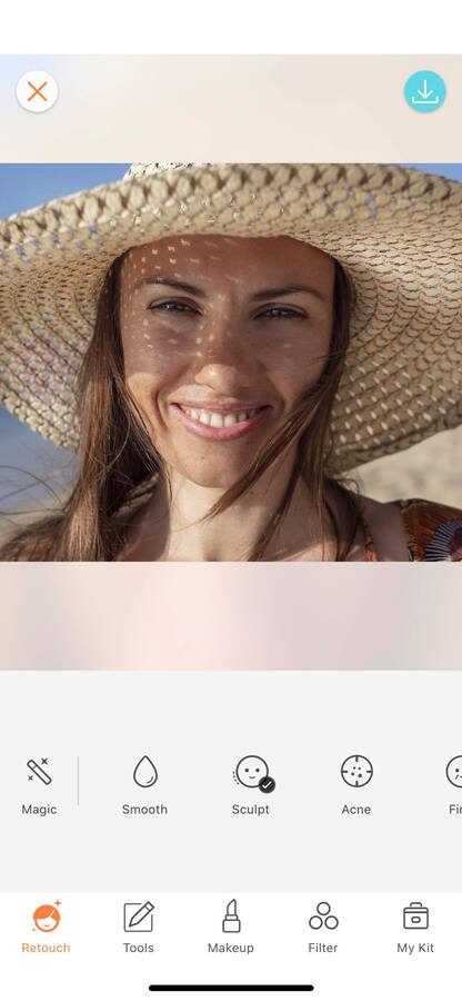 smiling woman wearing a hat