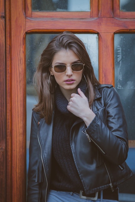 woman wearing black leather jacket and sunglasses