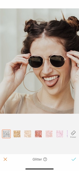 closeup of laughing woman wearing sunglasses