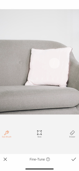 closeup of white pillow on grey couch