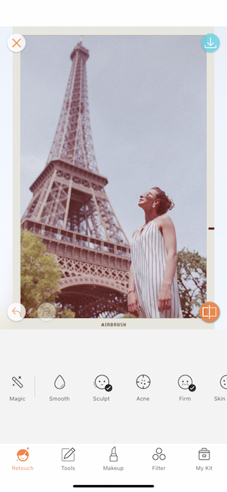 vintage photo of white woman standing in front of the Eiffel Tower