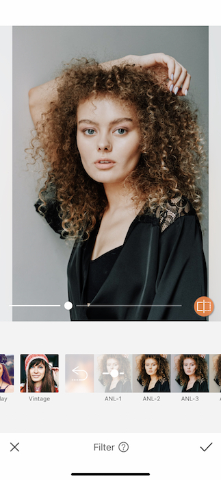 picture white woman with curly hair being edited by AirBrush with filter