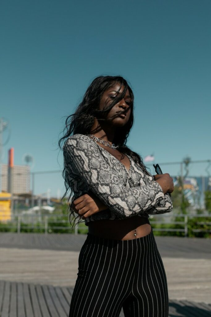 Picture of a black woman with her arms crossed