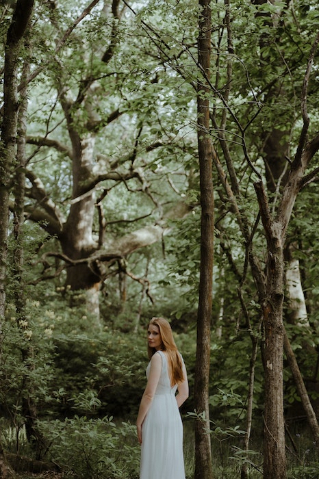 Picture of a white woman in the forest