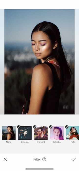 Picture of a woman posing and looking down being edited by AirBrush