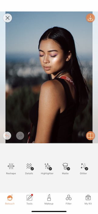 Picture of a woman posing and looking down being edited by AirBrush