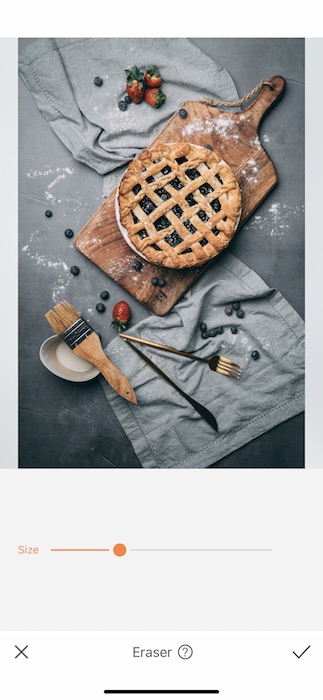 pie on cutting board with fruits and kitchen towels