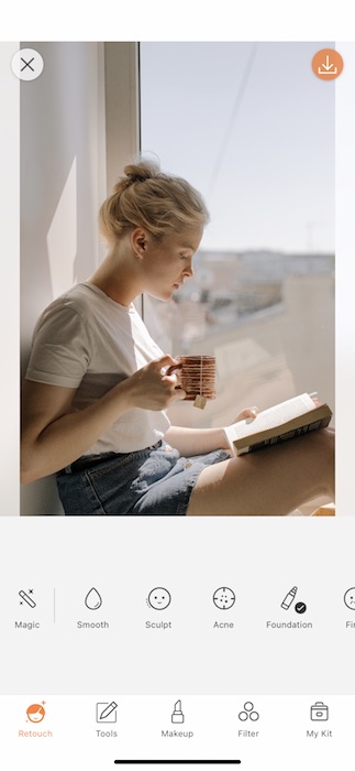Picture of a white woman with pink hair drinking tea being edited with the Contrast, by AirBrush 