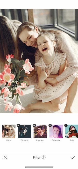 mother hugging toddler daughter and laughing