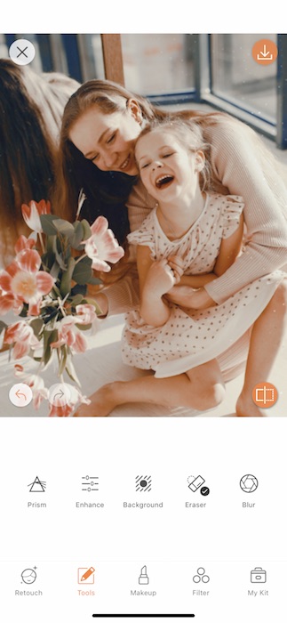 mother hugging toddler daughter and laughing