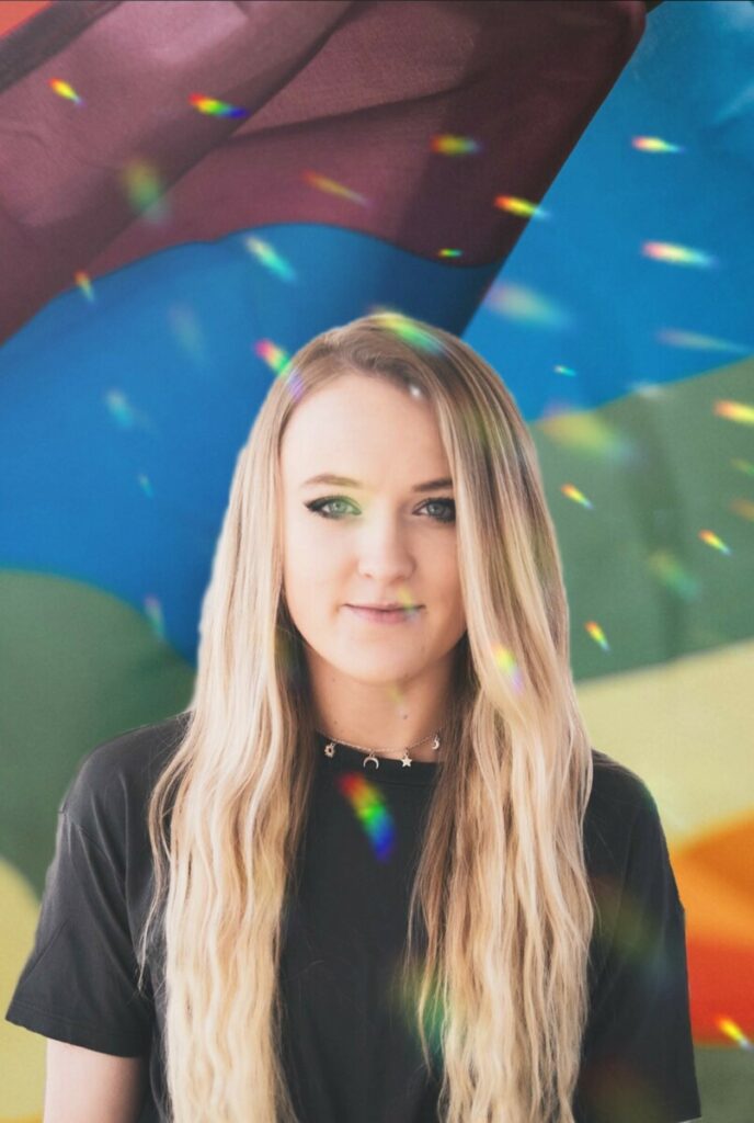 Pride Month edit of blonde woman wearing a black tshirt in front of colorful background