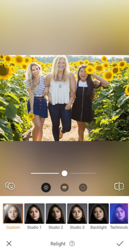 three women in a sunflower field
