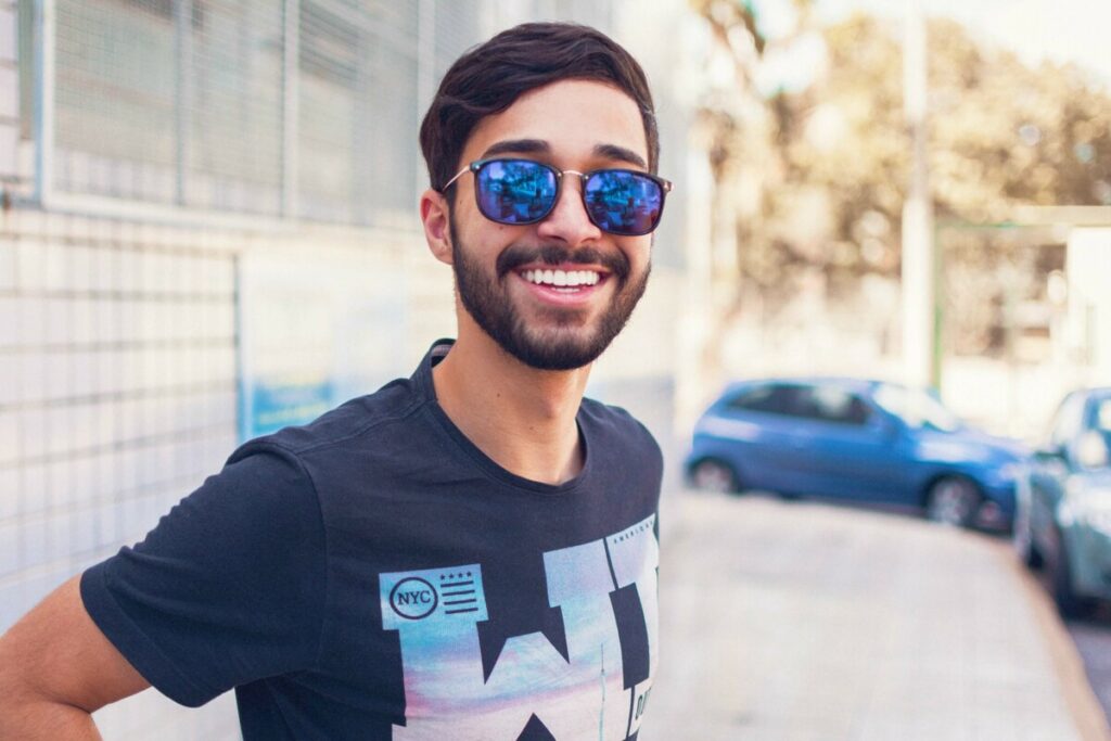 Virgo edit of a smiling man wearing sunglasses