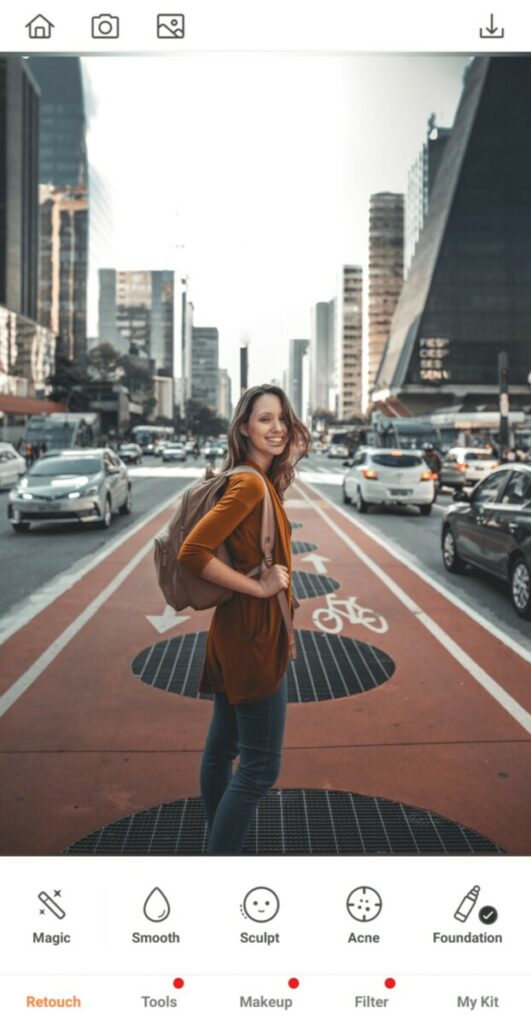 woman standing in the middle of a busy city street
