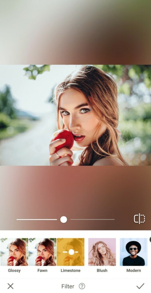 Prism makeup filter edit of woman holding an apple