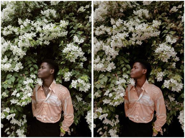 homem negro com plantas e flores em volta