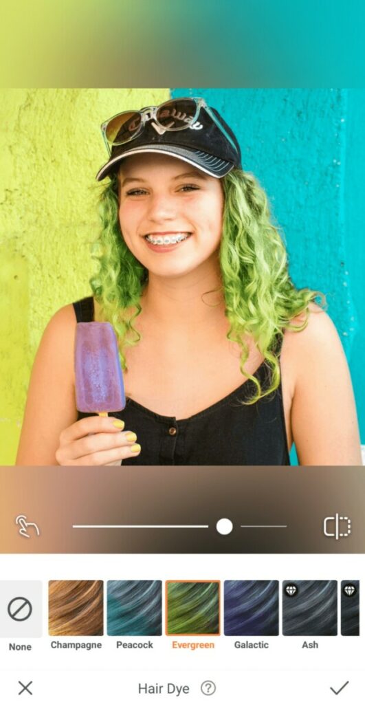 woman with green hair holding a popsicle