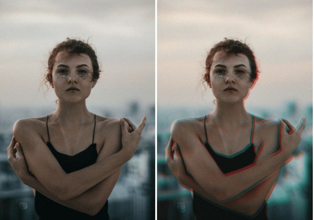 woman standing on a rooftop hugging herself