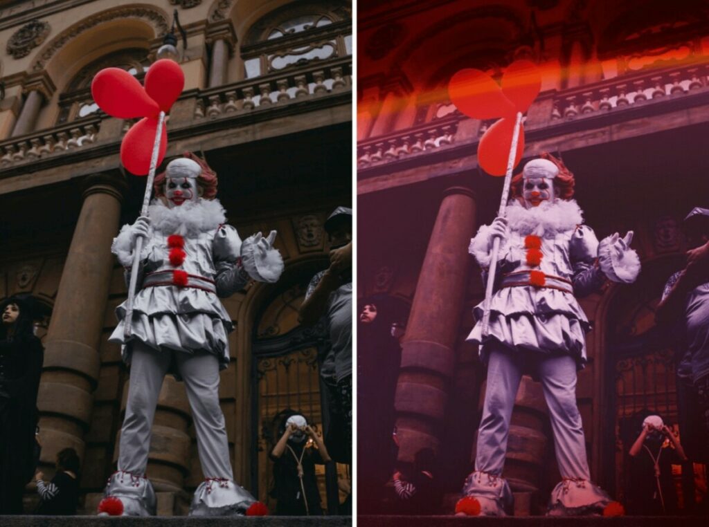 Pennywise the clown holding red balloons