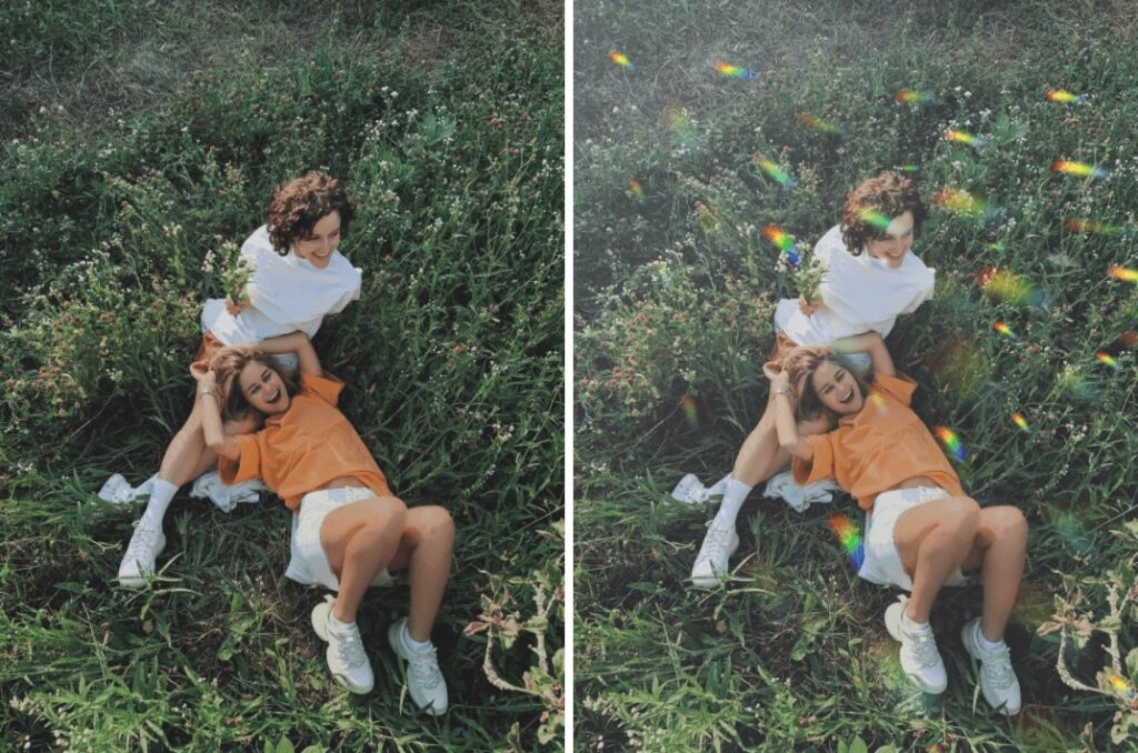 two girls laying in a field of grass smiling