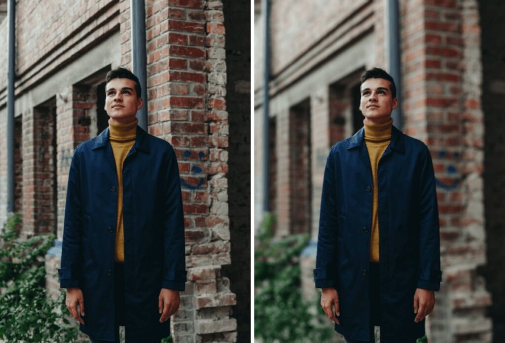 man standing in front of red brick building wearing a yellow turtle neck and black jacket