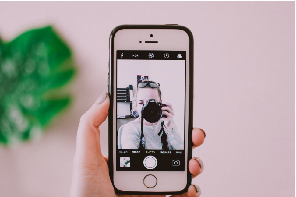 shot of woman with a digital camera