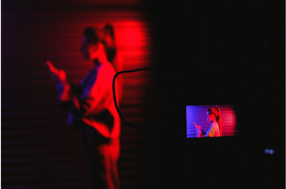 shot of woman standing in dim light