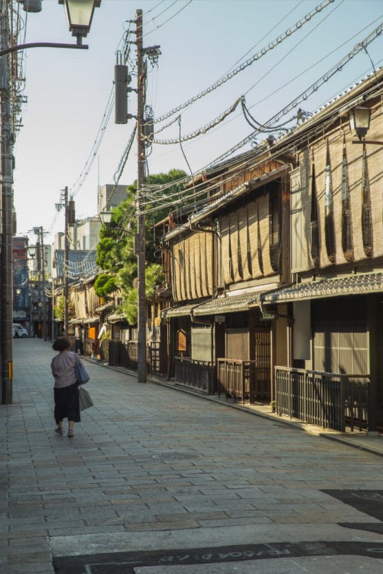 woman walking down an empty street