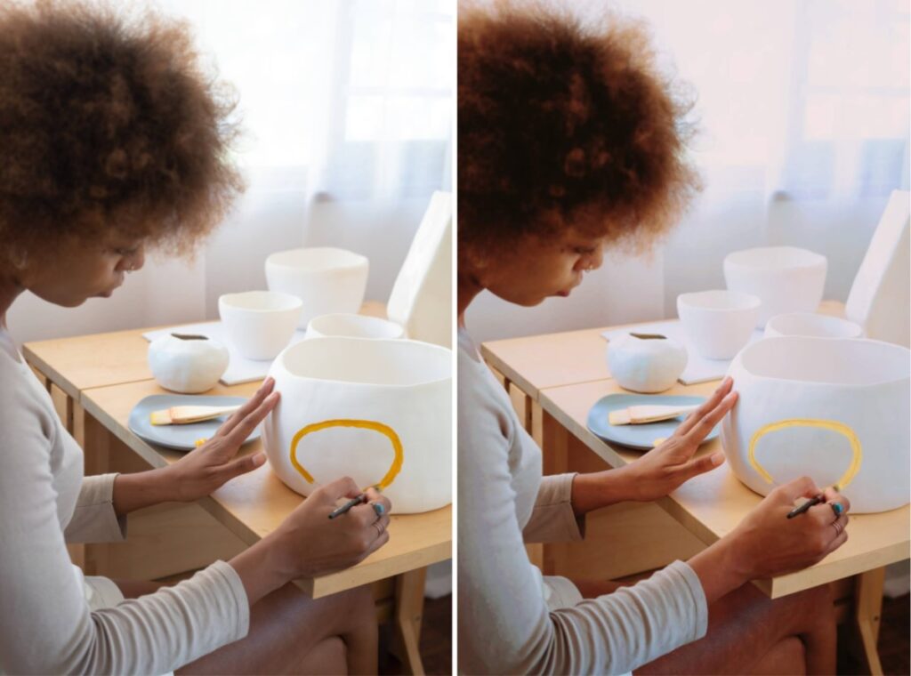 woman painting a vase