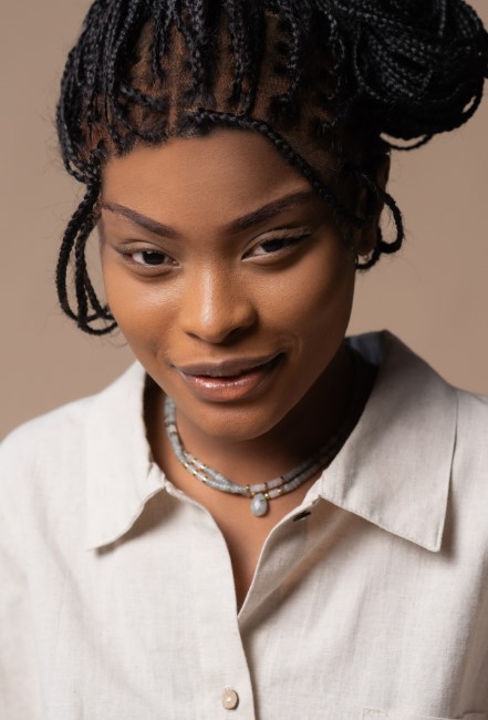 headshot of woman with braids