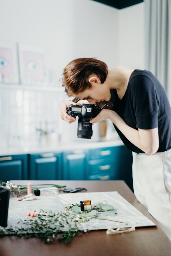 photographer with flat lay